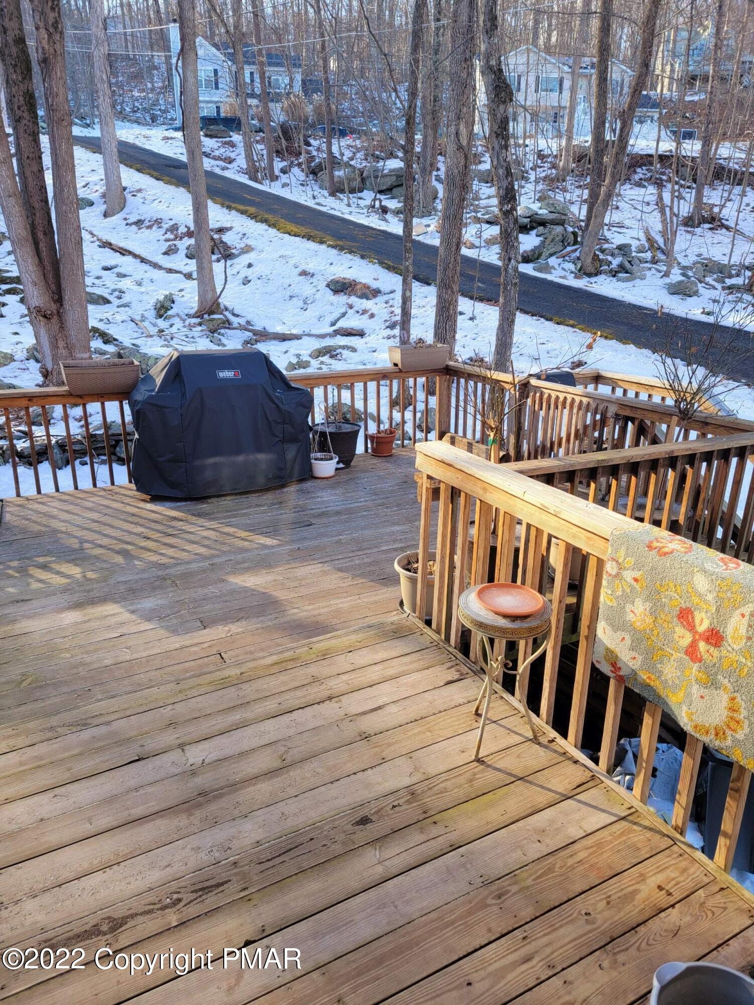 5665 Decker Road Bushkill, PA 18324 - Photo 30 of 32 a balcony with furniture and wooden floor