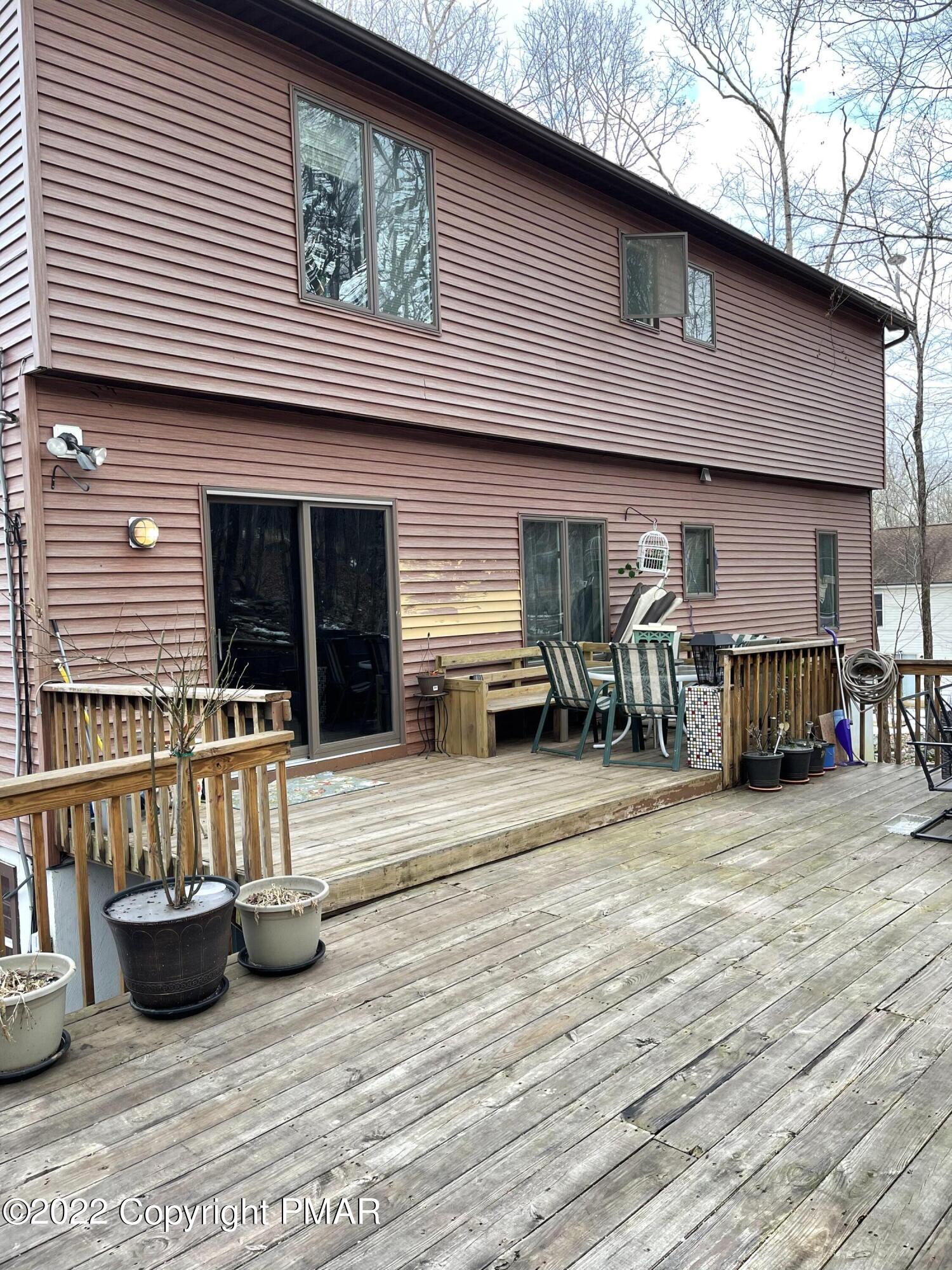 5665 Decker Road Bushkill, PA 18324 - Photo 5 of 32 a view of a house with large windows