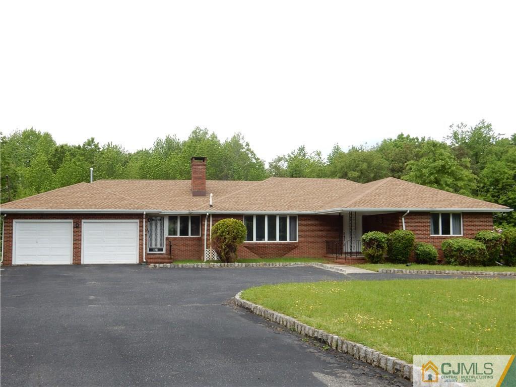 428 Morristown Road Old Bridge, NJ 07747 - Photo 1 of 25 a front view of a house with a garden
