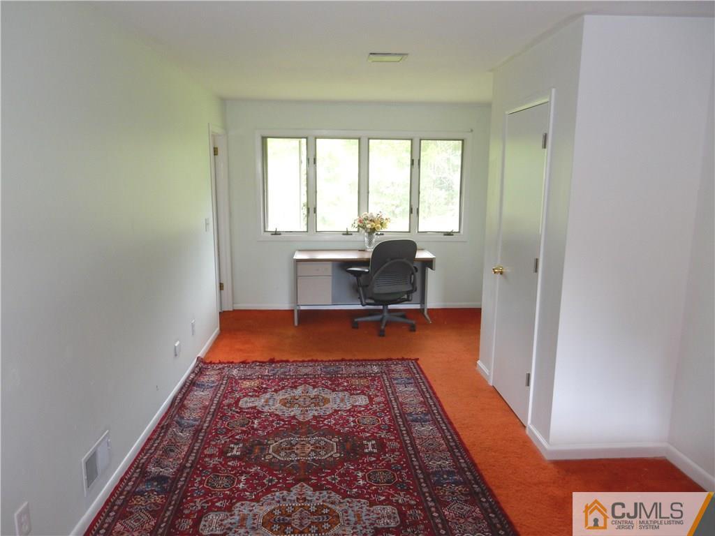 428 Morristown Road Old Bridge, NJ 07747 - Photo 12 of 25 a bed room with a bed and a window