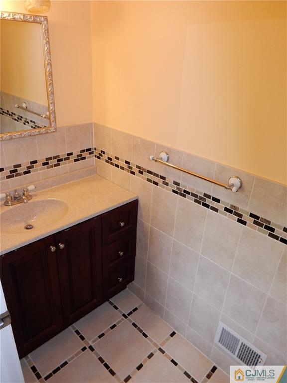 428 Morristown Road Old Bridge, NJ 07747 - Photo 18 of 25 a bathroom with a sink and a mirror