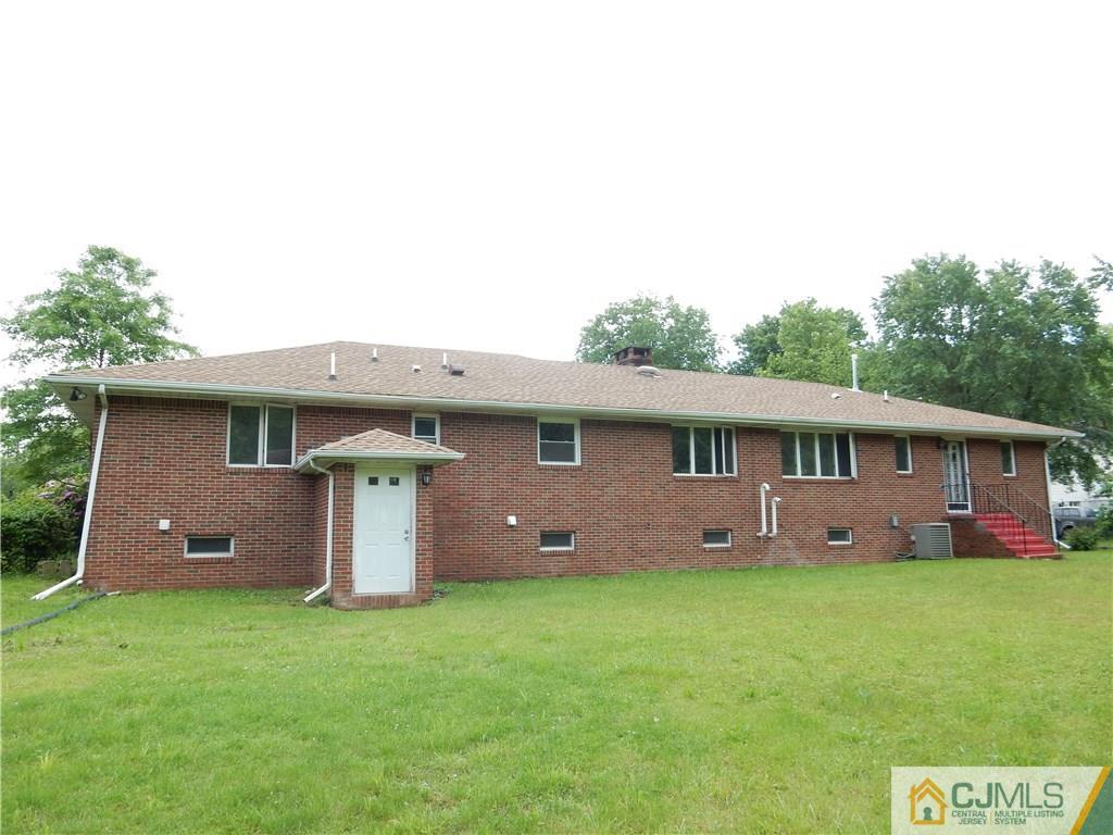 428 Morristown Road Old Bridge, NJ 07747 - Photo 24 of 25 a view of a house with a yard and plants