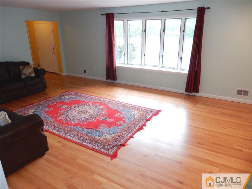 428 Morristown Road Old Bridge, NJ 07747 - Photo 4 of 25 a view of a living room with a rug