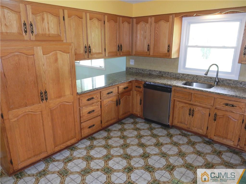 428 Morristown Road Old Bridge, NJ 07747 - Photo 9 of 25 a kitchen with sink cabinets and window