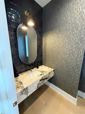 a bedroom with double bed and a large window