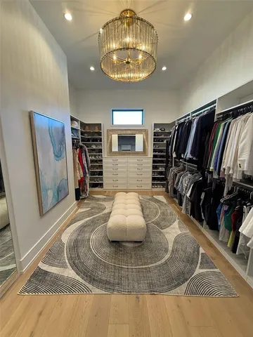 a bedroom with a large bed and a couch