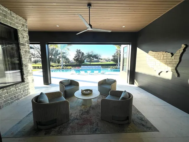 a view of a dining area with furniture and chandelier