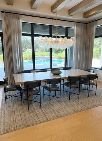 a bedroom with furniture and a chandelier