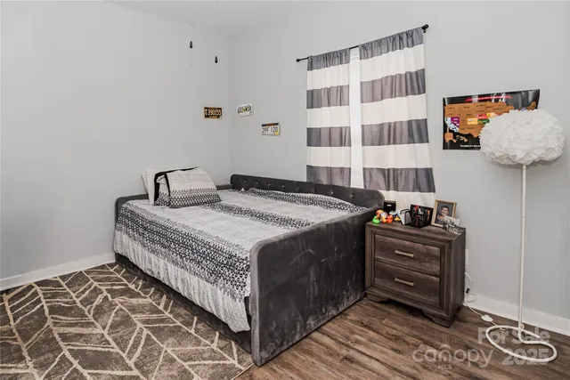 a bedroom with a bed and cabinets