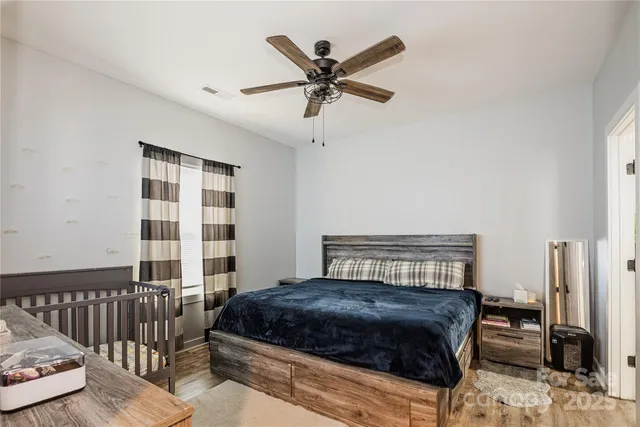 a bedroom with a bed and dresser