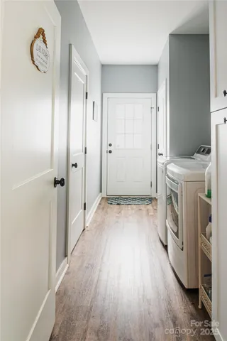 a view of a storage & utility room with washer and dryer