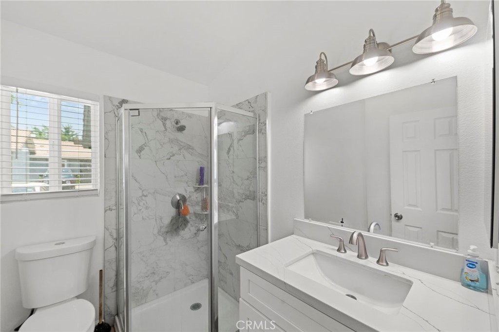9505 Arlington Avenue, Unit 54 Riverside, CA 92503 - Photo 19 of 29 a bathroom with a sink a toilet and shower