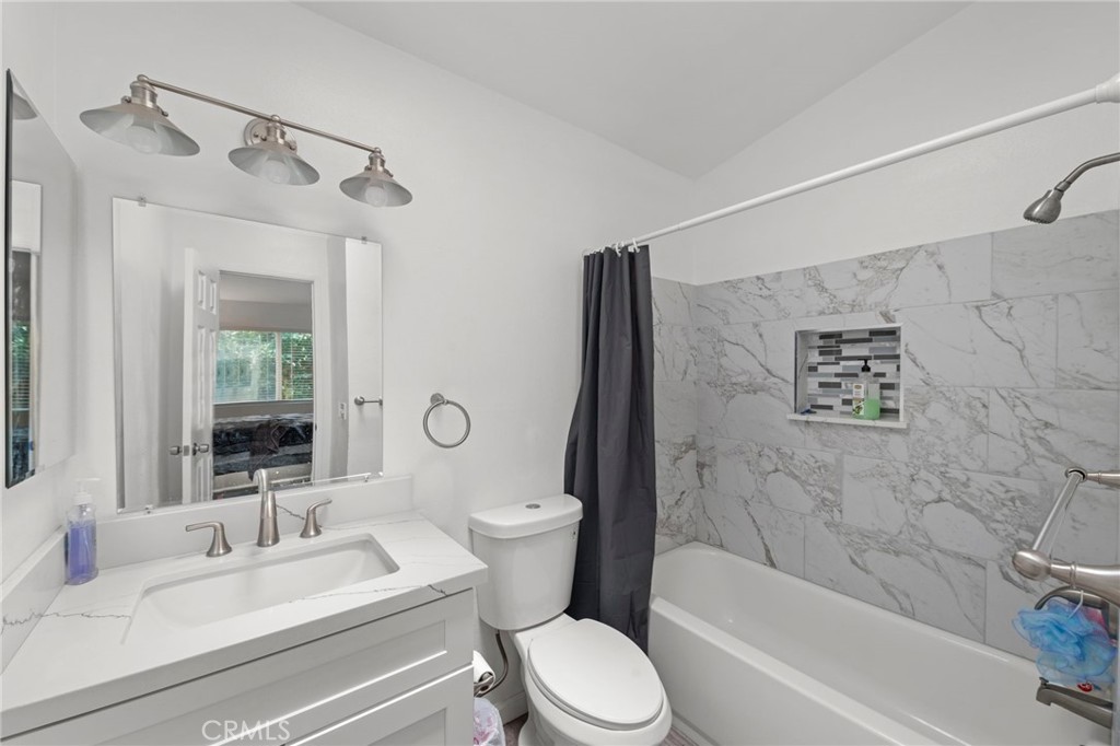 9505 Arlington Avenue, Unit 54 Riverside, CA 92503 - Photo 22 of 29 a bathroom with a sink toilet and shower