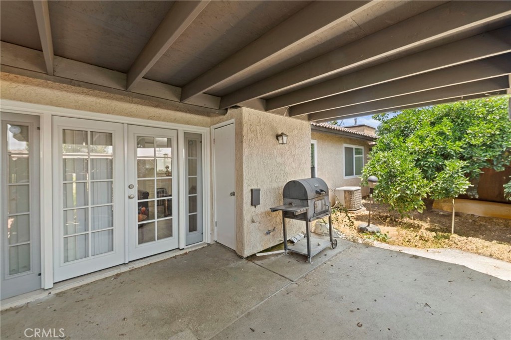 9505 Arlington Avenue, Unit 54 Riverside, CA 92503 - Photo 23 of 29 a view of a patio with table and chairs and potted plants