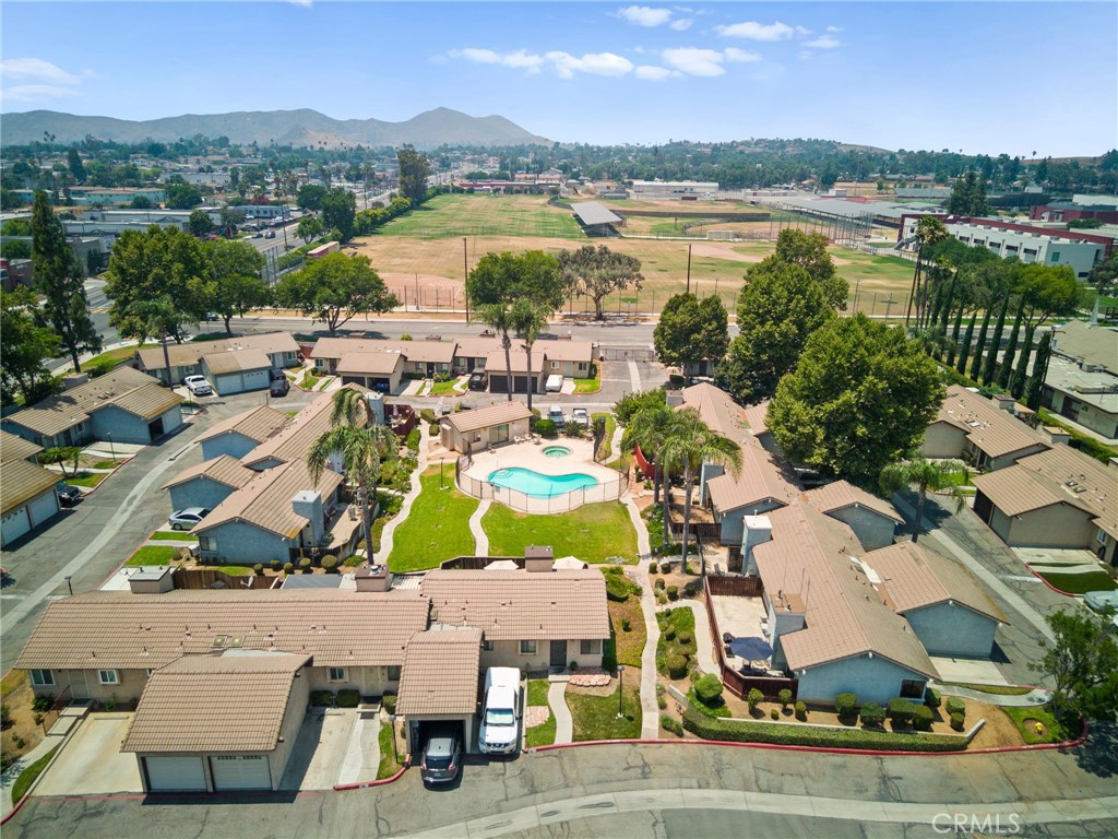 9505 Arlington Avenue, Unit 54 Riverside, CA 92503 - Photo 28 of 29 an aerial view of residential building with outdoor space and lake view