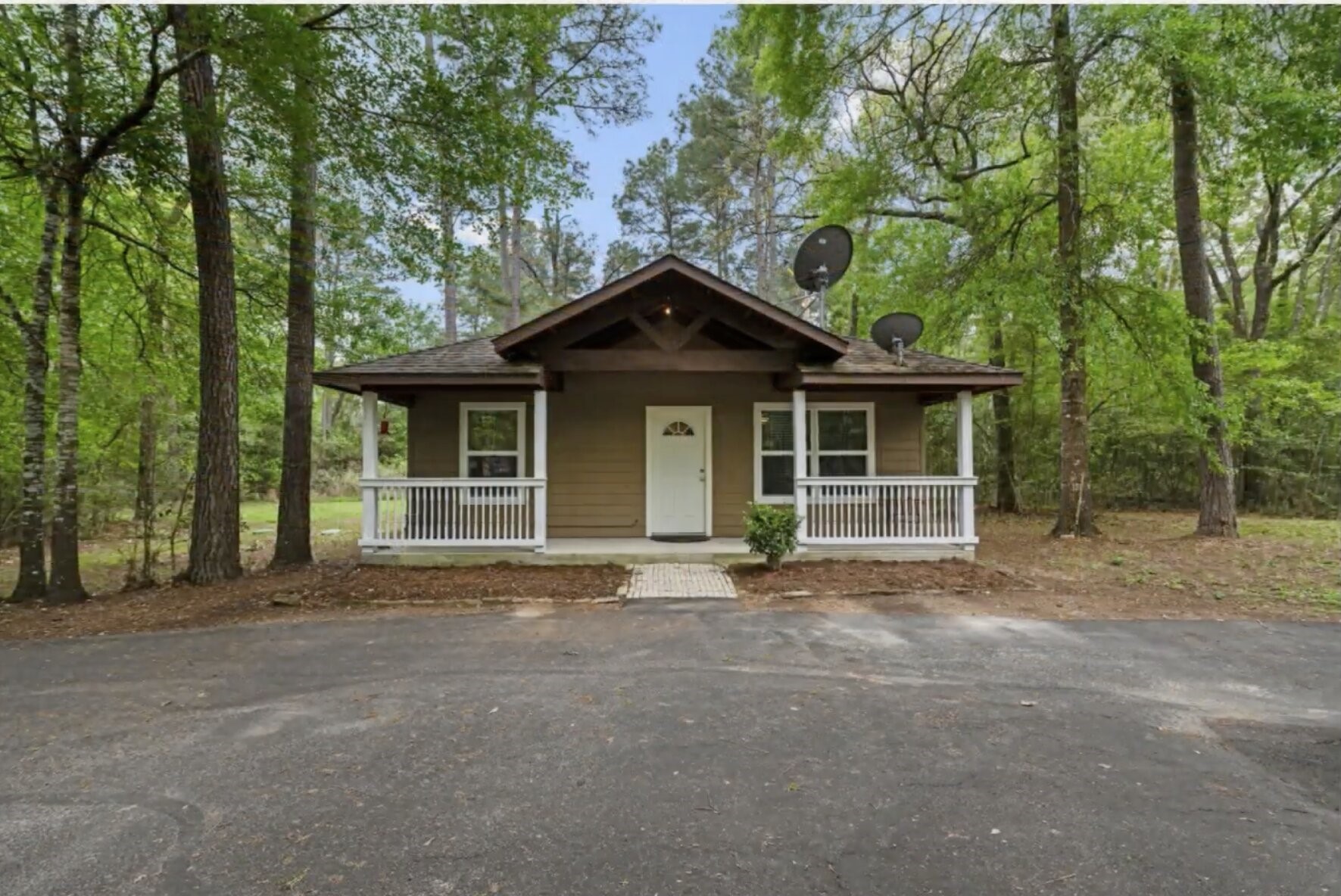 30338 Riley Road Waller, TX 77484 - Photo 45 of 46 a front view of a house with a garden and trees