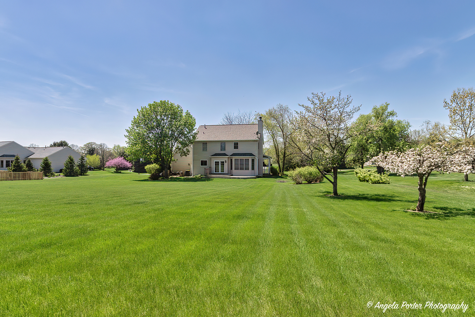 10916 East Riviera Drive Spring Grove, IL 60081 - Photo 35 of 43 a view of a house with a big yard