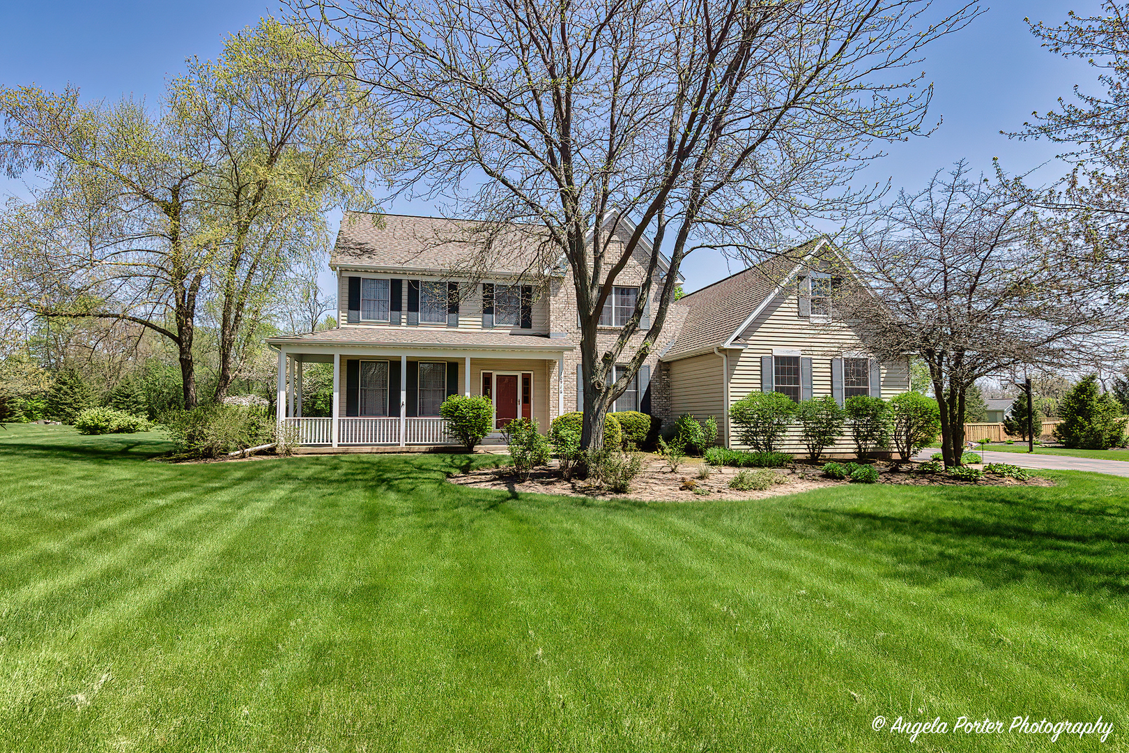 10916 East Riviera Drive Spring Grove, IL 60081 - Photo 41 of 43 a front view of house with yard and green space