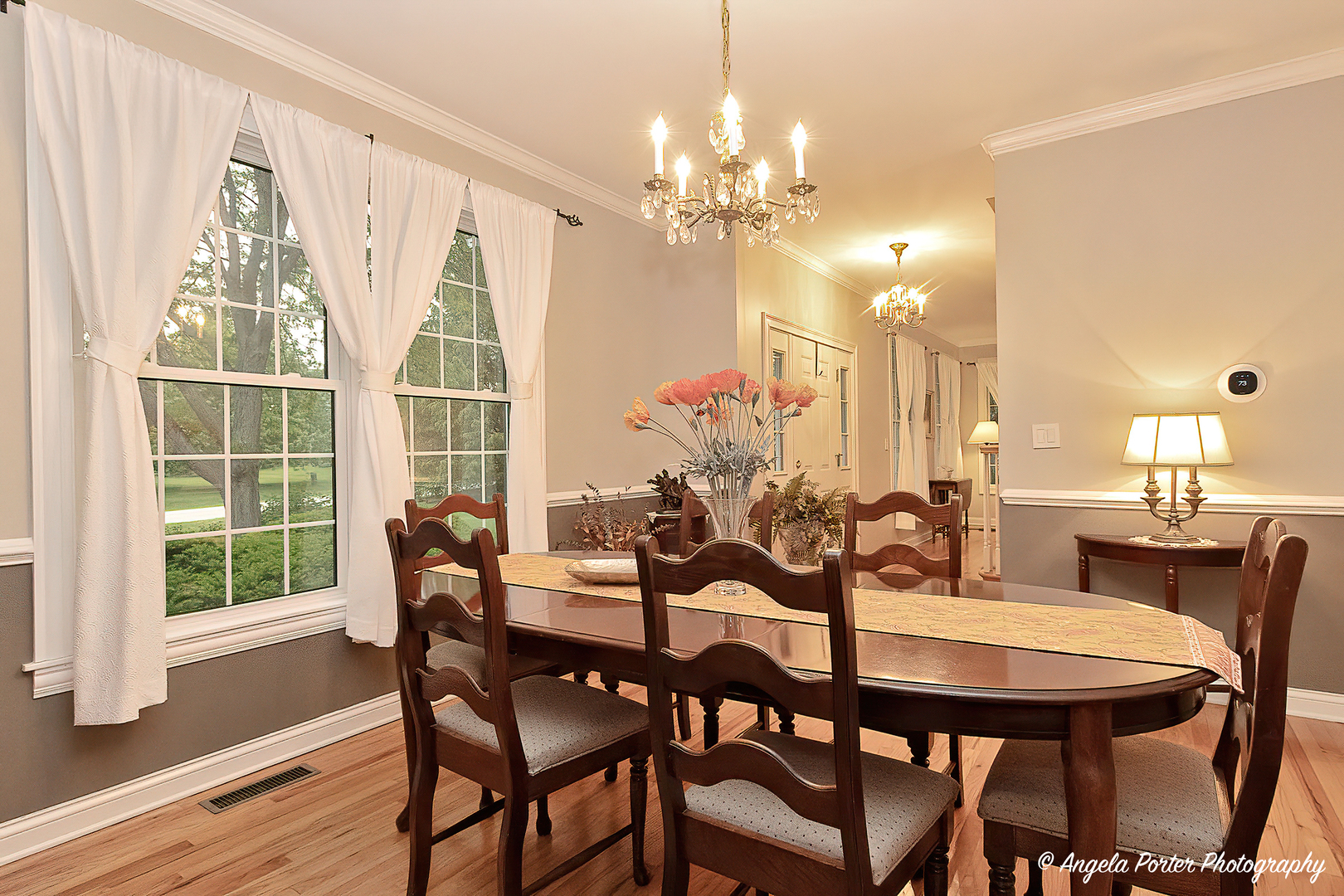 10916 East Riviera Drive Spring Grove, IL 60081 - Photo 8 of 43 a view of a dining room with furniture window and wooden floor