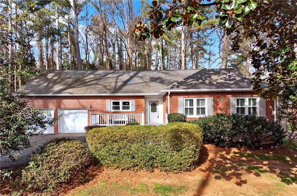 front view of a house with a garden