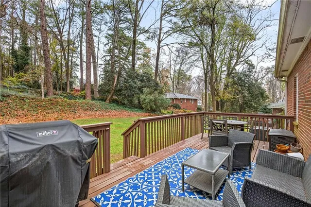 a view of a roof deck with furniture