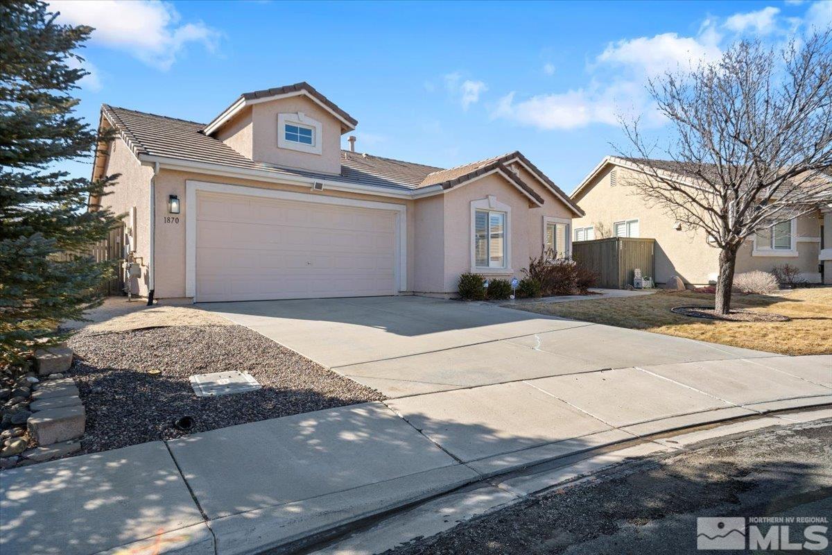 1870 D'Arques Court Reno, NV 89521 - Photo 1 of 33 a front view of a house with a yard