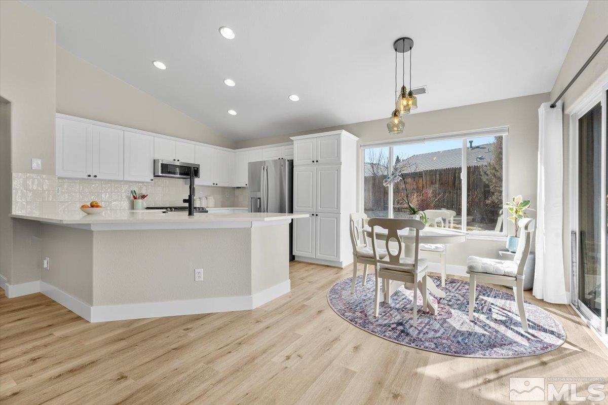 1870 D'Arques Court Reno, NV 89521 - Photo 11 of 33 a view of kitchen with cabinets and wooden floor