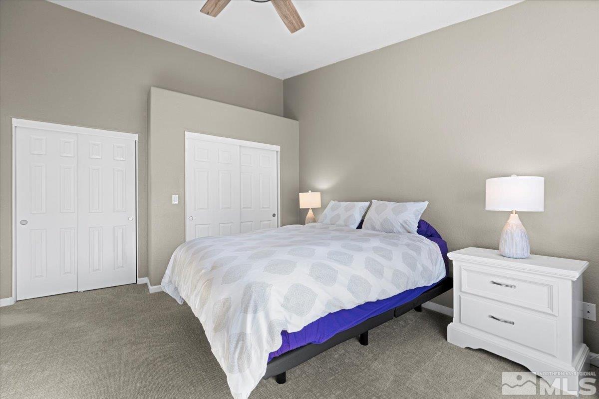 1870 D'Arques Court Reno, NV 89521 - Photo 18 of 33 a bedroom with a bed and a night stand