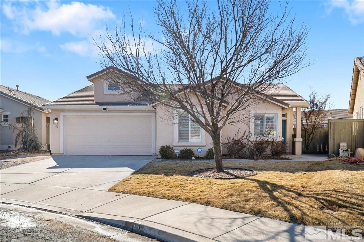 1870 D'Arques Court Reno, NV 89521 - Photo 2 of 33 a front view of a house with a yard