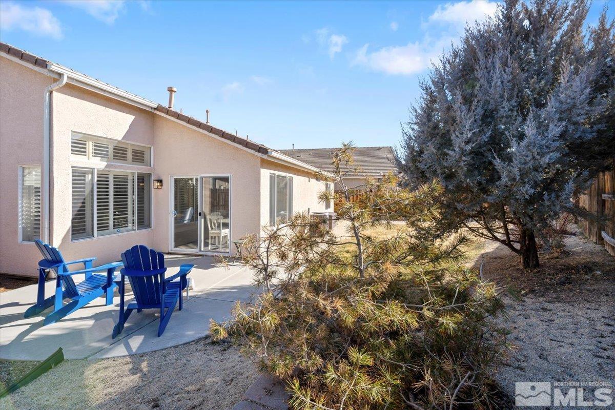 1870 D'Arques Court Reno, NV 89521 - Photo 29 of 33 a view of backyard with outdoor seating and plants