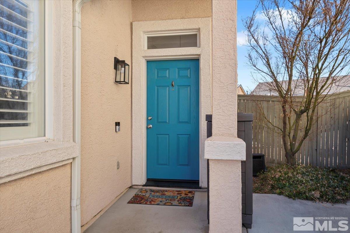 1870 D'Arques Court Reno, NV 89521 - Photo 4 of 33 a view of a house with a door and wooden fence