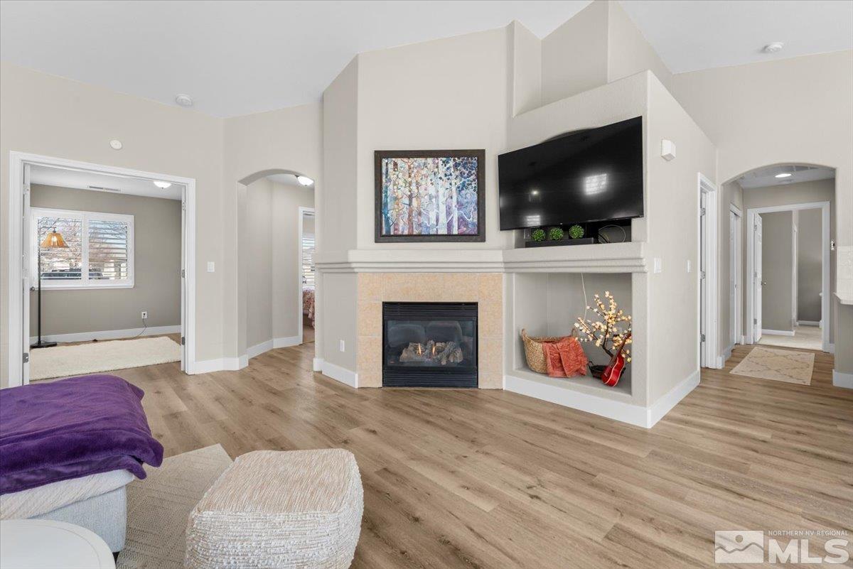 1870 D'Arques Court Reno, NV 89521 - Photo 10 of 33 a living room with furniture a flat screen tv and a fireplace