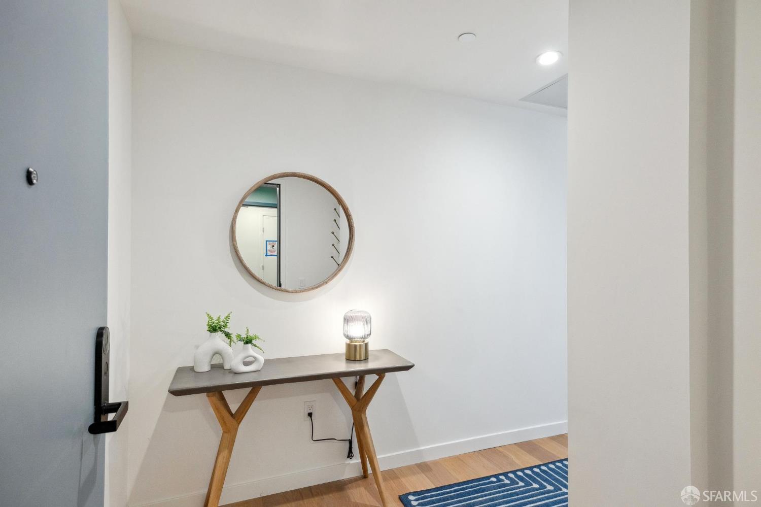 988 Harrison Street, Unit CK3 San Francisco, CA 94107 - Photo 2 of 15 a view of a hallway with paintings on the wall
