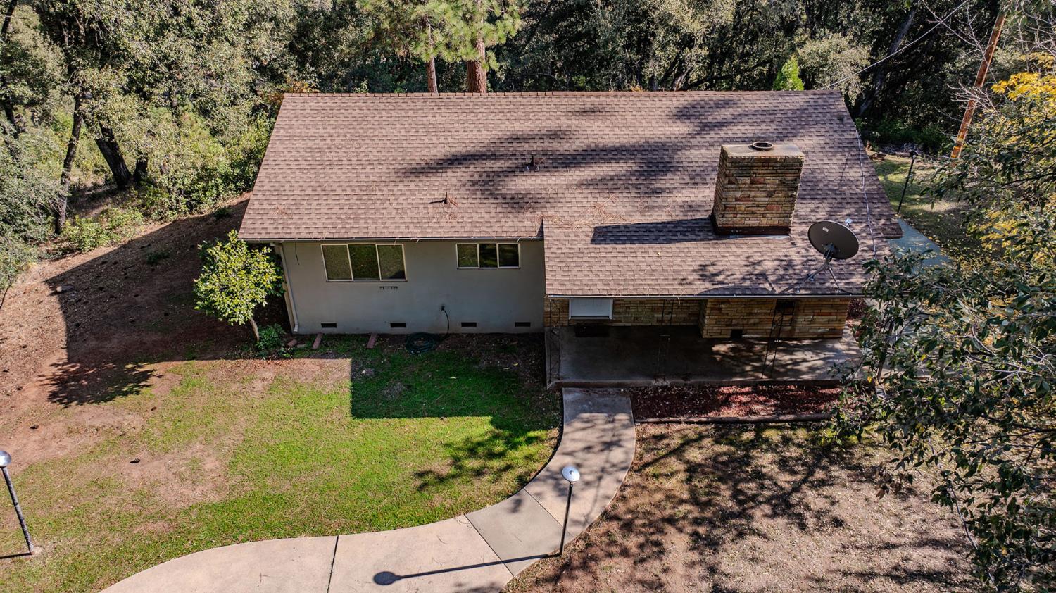 13309 Taves Road Jackson, CA 95642 - Photo 24 of 62 a aerial view of a house with a yard and large trees