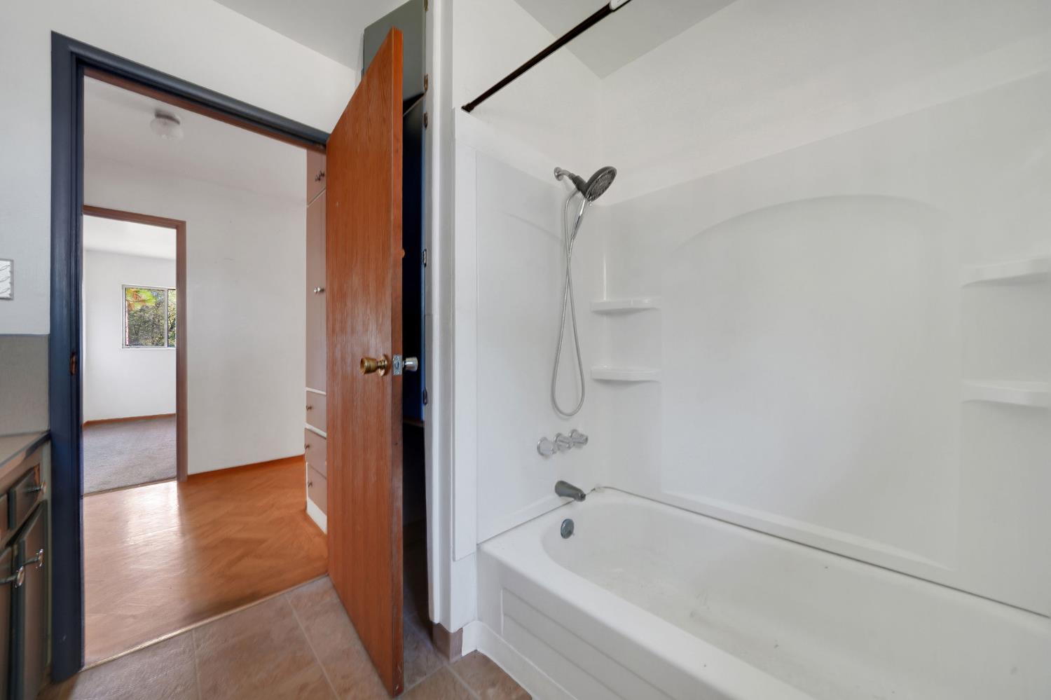 13309 Taves Road Jackson, CA 95642 - Photo 60 of 62 a bathroom with a bathtub and a shower