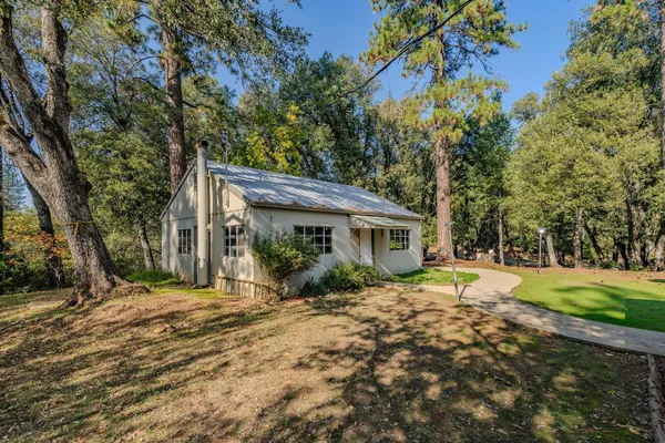 a view of a livingroom with furniture and a window