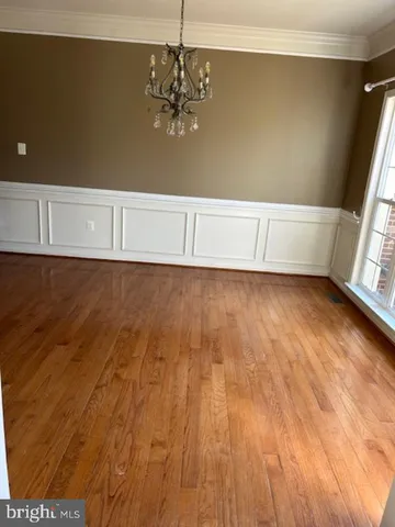 a view of a livingroom with wooden floor