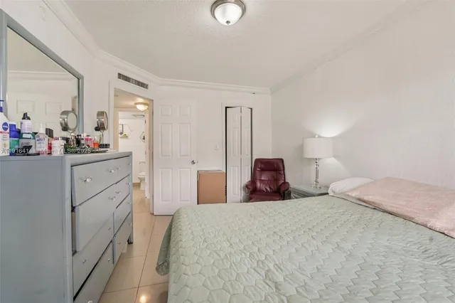 a bedroom with a bed and a cabinets