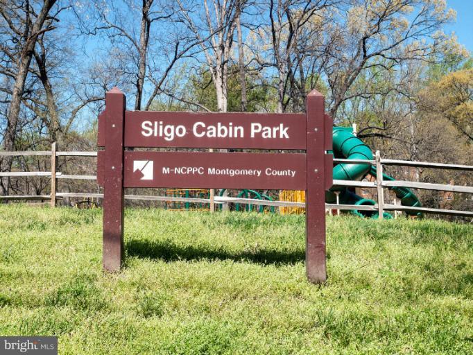 8813 Bradford Road Silver Spring, MD 20901 - Photo 12 of 23 a view of a park that has sign board