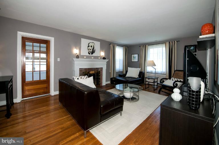 8813 Bradford Road Silver Spring, MD 20901 - Photo 13 of 23 a living room with furniture and a fireplace