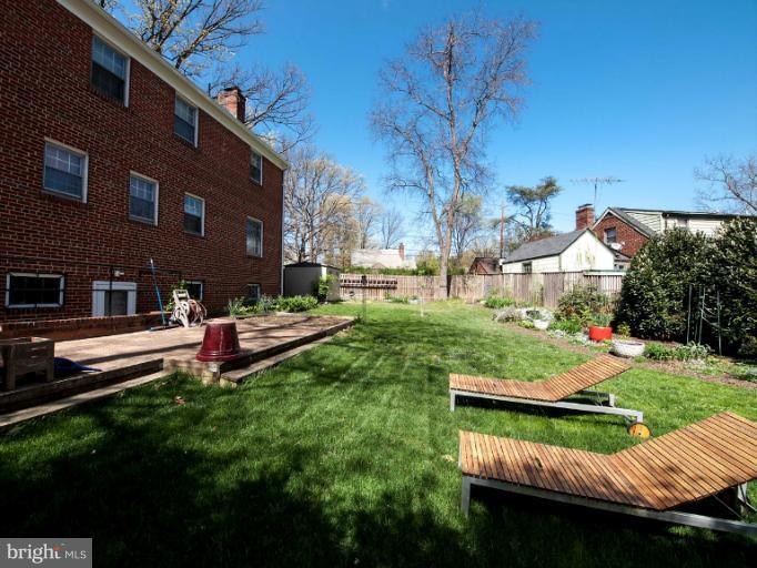 8813 Bradford Road Silver Spring, MD 20901 - Photo 14 of 23 a view of backyard with seating area and trees