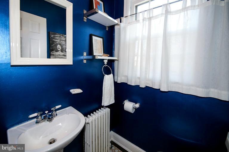 8813 Bradford Road Silver Spring, MD 20901 - Photo 19 of 23 a bathroom with a sink and a mirror