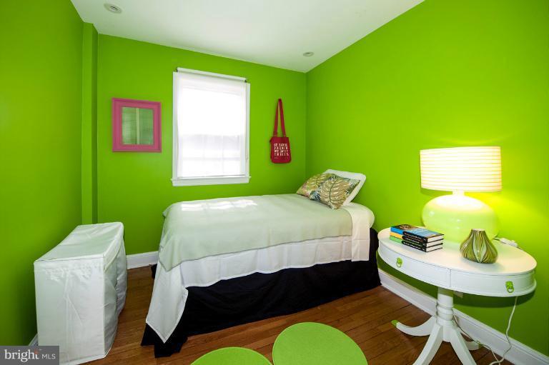 8813 Bradford Road Silver Spring, MD 20901 - Photo 20 of 23 a bedroom with a bed chair and a window