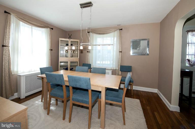 8813 Bradford Road Silver Spring, MD 20901 - Photo 6 of 23 a view of a dining room with furniture window and wooden floor
