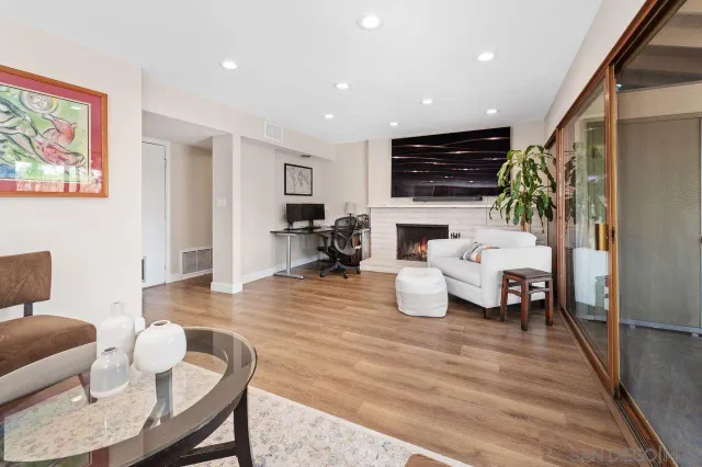 a living room with furniture or couch and a flat screen tv