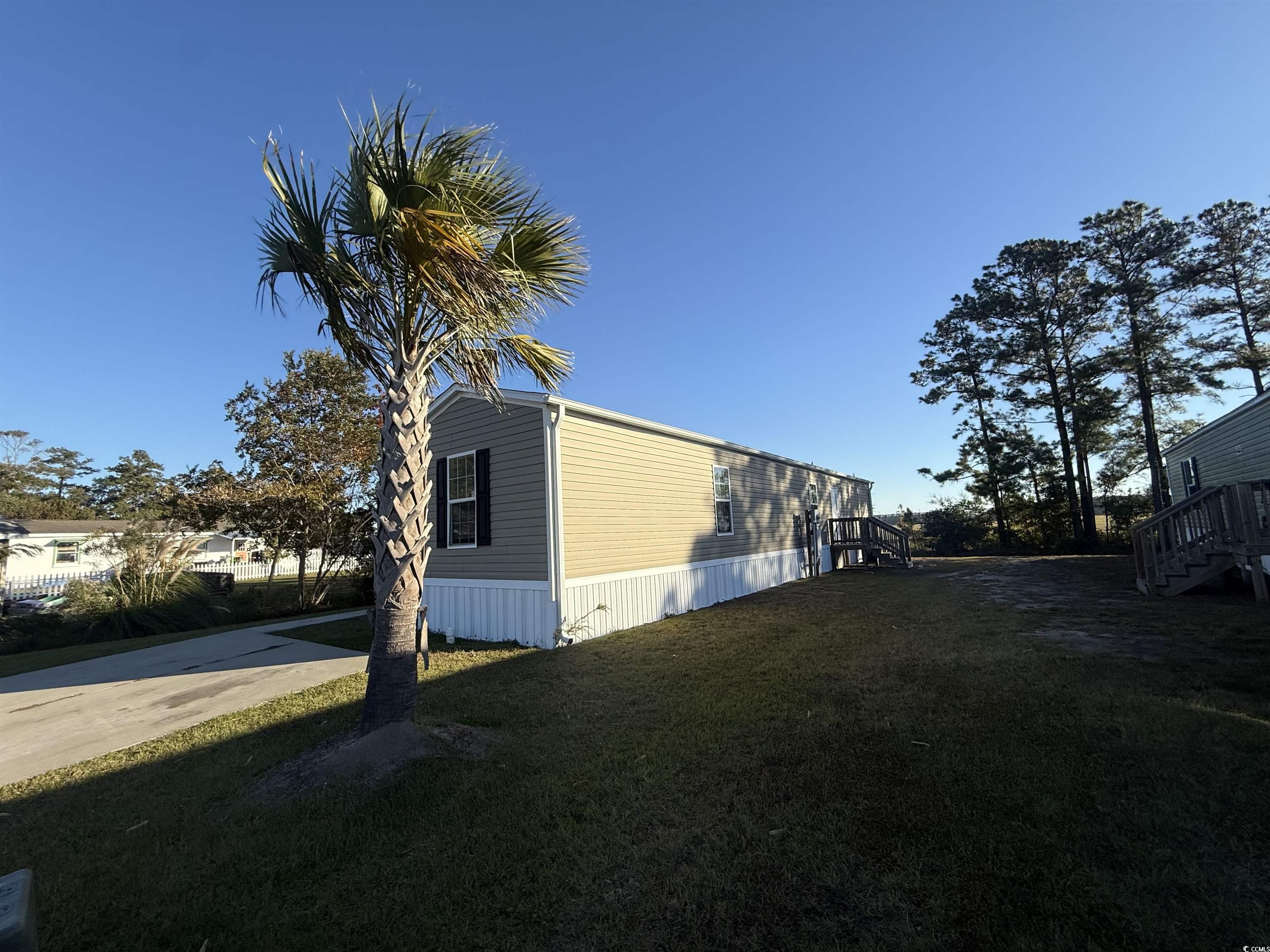 380 Hangar Court Myrtle Beach, SC 29577 - Photo 16 of 16 Spare room with dark wood finished floors and a textured ceiling