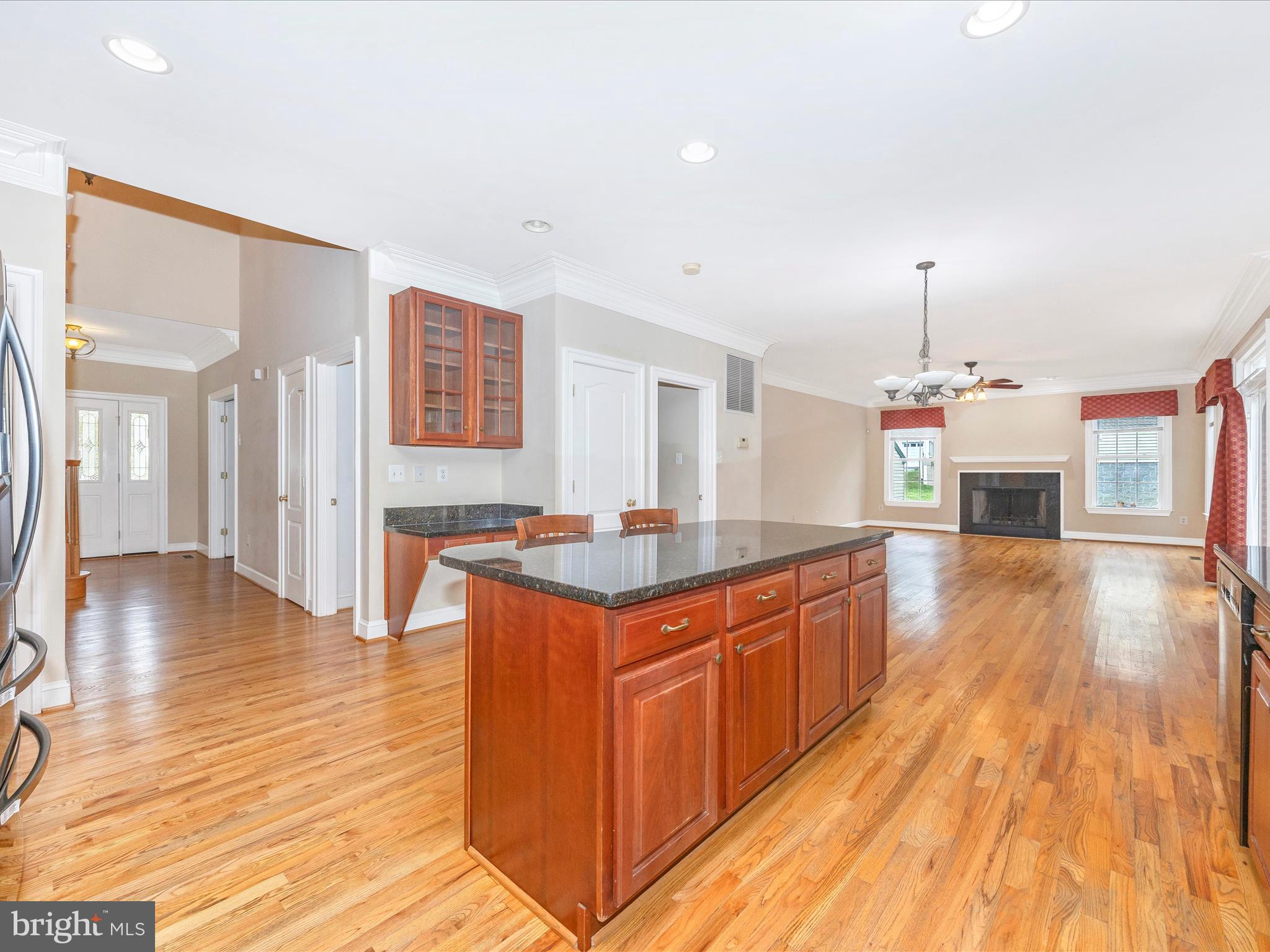 18818 Liberty Mill Road Germantown, MD 20874 - Photo 16 of 39 a kitchen with stainless steel appliances granite countertop a sink stove and wooden floor
