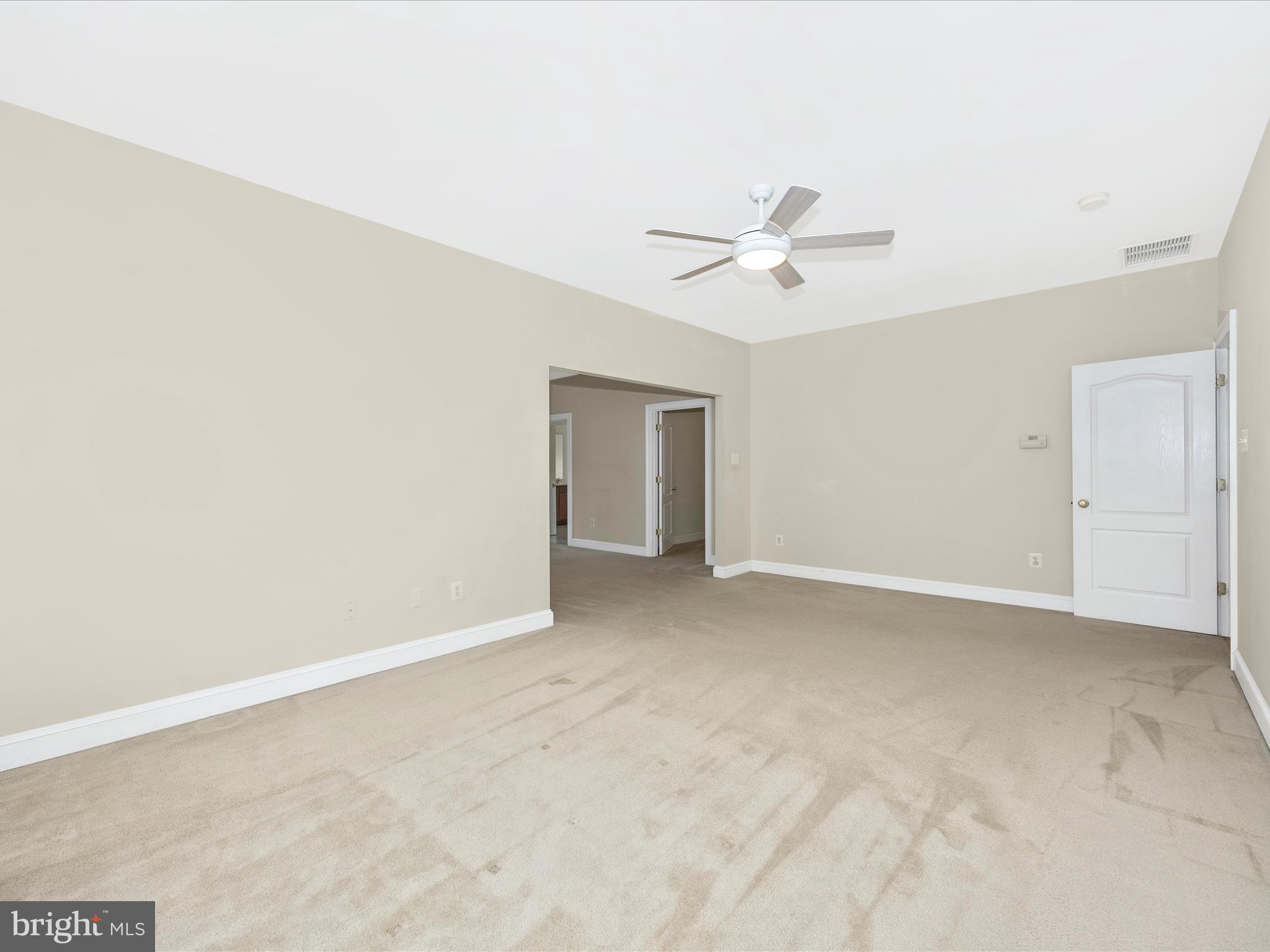 18818 Liberty Mill Road Germantown, MD 20874 - Photo 20 of 39 an empty room with a ceiling fan and a window