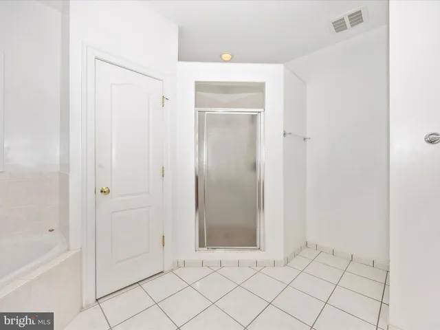 a view of bathroom with mirror