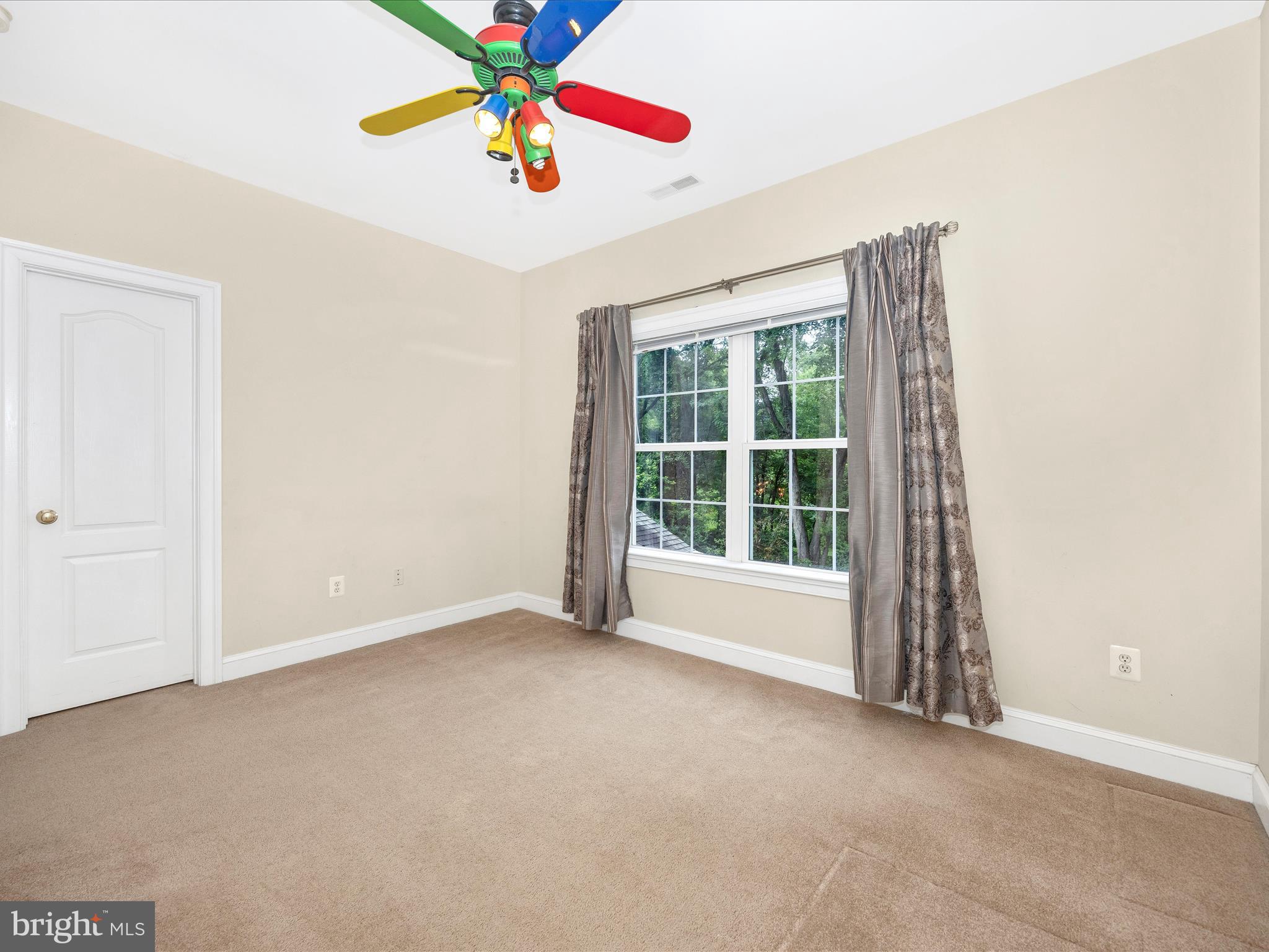 18818 Liberty Mill Road Germantown, MD 20874 - Photo 24 of 39 an empty room with windows and chandelier fan